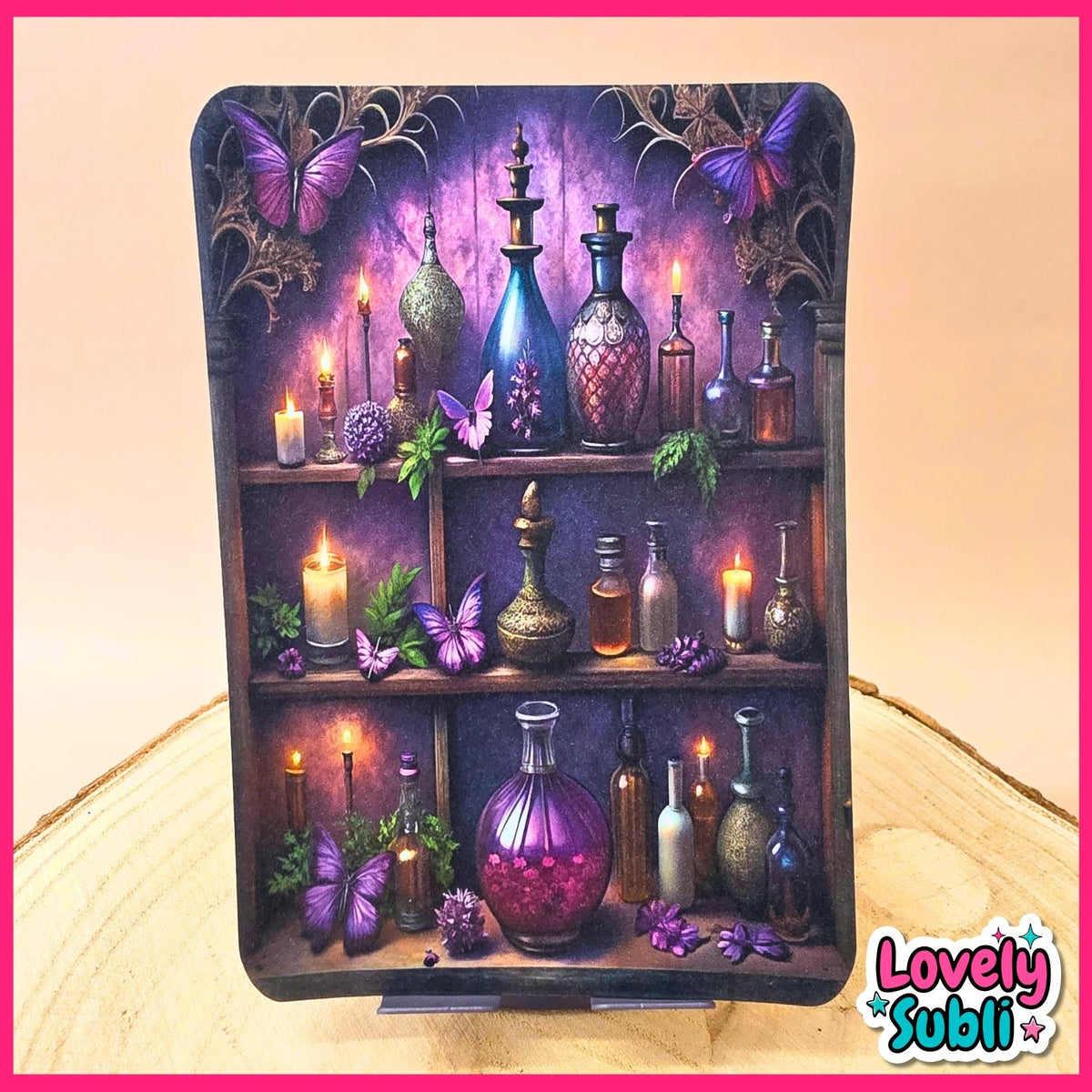 A rectangular decorative plaque or print featuring a whimsical shelf scene with purple butterflies, lit candles, and assorted glass bottles against a purple background. The item is displayed upright on a small stand on a light wood surface, with a pink border around the image and a 'Lovely Subli' logo in the lower right corner.