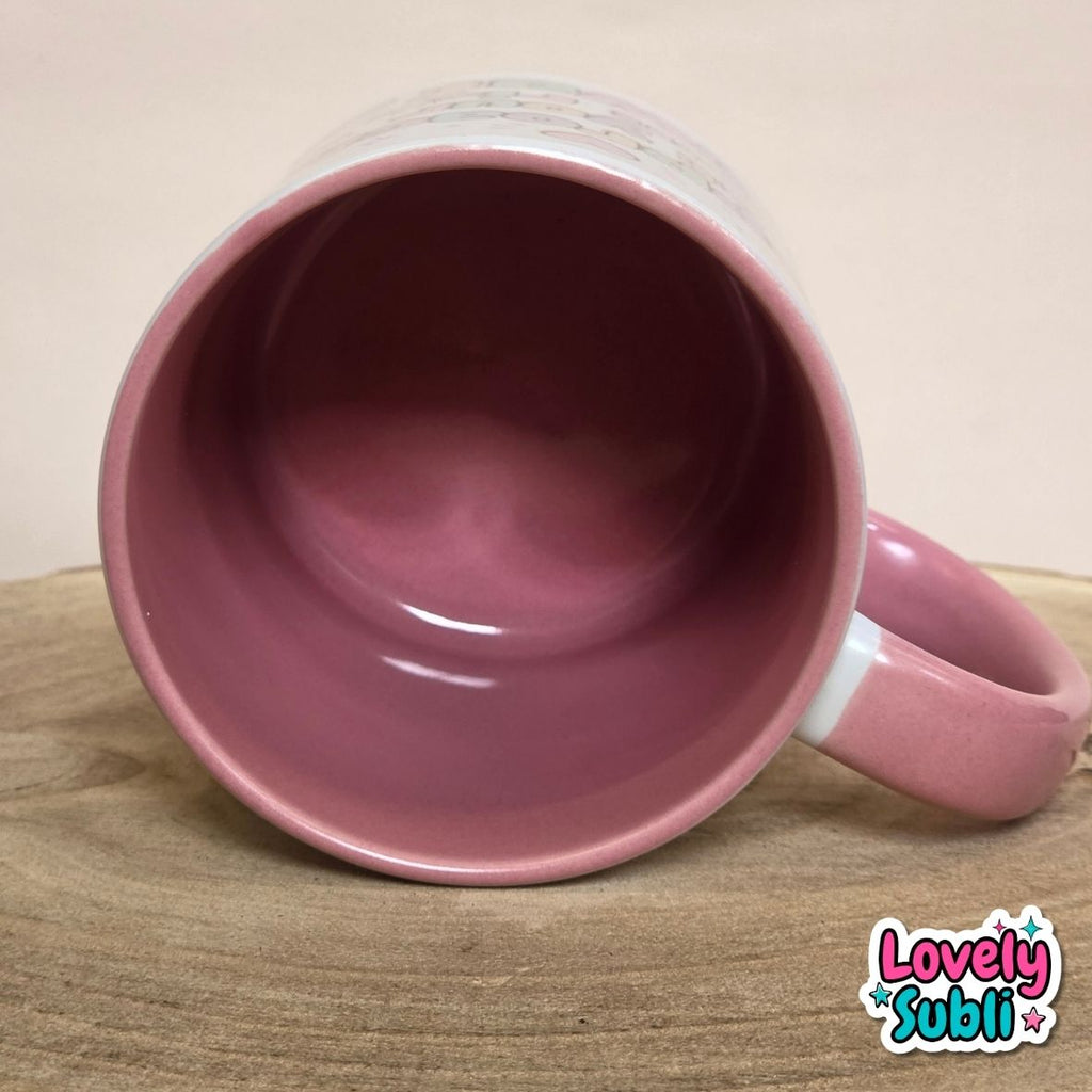 A pink ceramic mug with a glossy dusty rose interior and handle, shown from a top-down angle on a wooden surface against a neutral beige background. A 'Lovely Subli' watermark is visible in the bottom right corner.