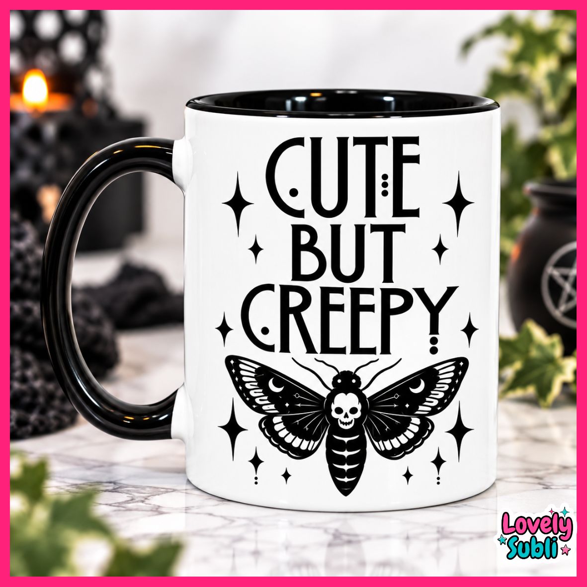 A white ceramic mug with a black handle and black interior, printed with the phrase 'CUTE BUT CREEPY' in black lettering above a black moth with a skull on its abdomen, surrounded by small black stars. The mug is photographed on a marble-like surface with a blurred Halloween-themed background.
