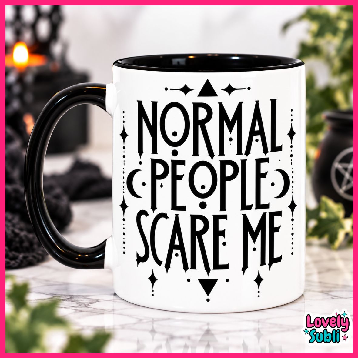 A white ceramic mug with a black handle and black interior, printed with the phrase 'NORMAL PEOPLE SCARE ME' in a gothic-style black font, surrounded by decorative symbols. The mug is set on a marble surface with a blurred background containing candles and plants.